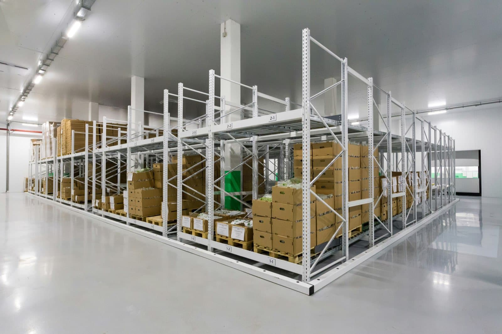 Warehouse racking stocked with boxed automation parts