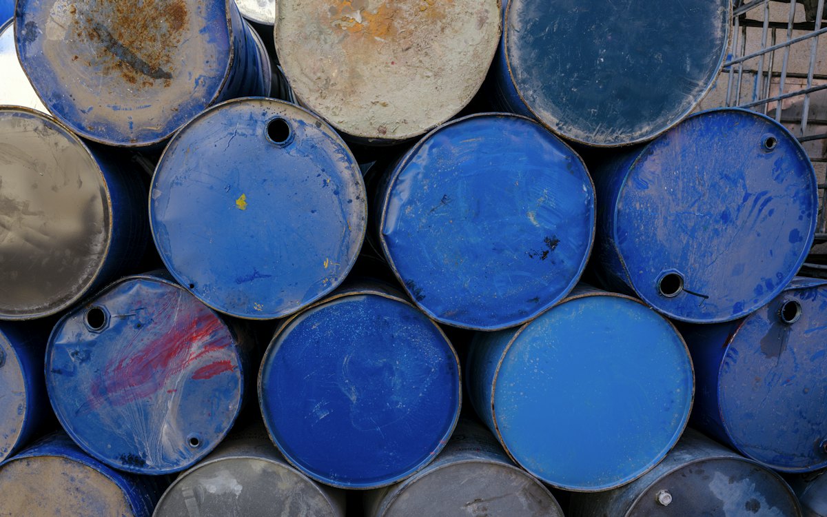 Stacked blue oil drums