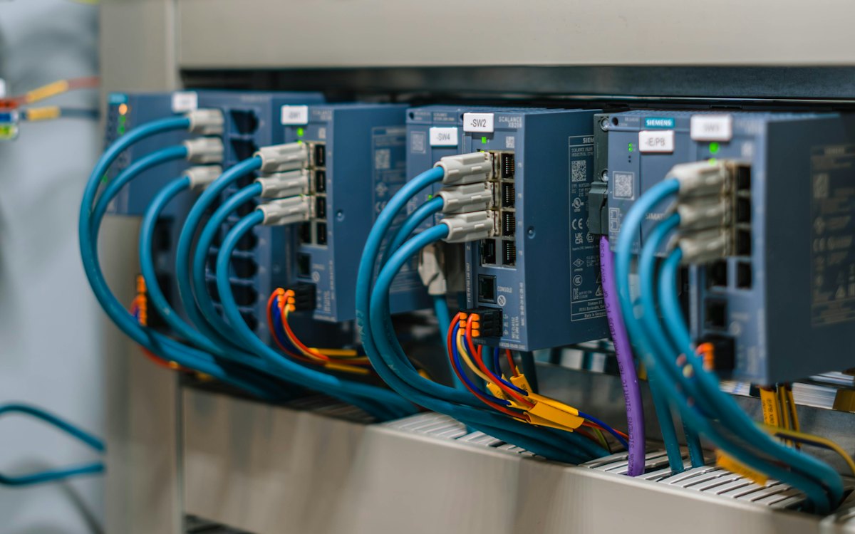 PLC and I/O modules wired in a control cabinet